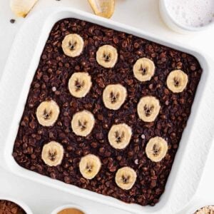 slice of chocolate baked oatmeal with bananas on a small white plate