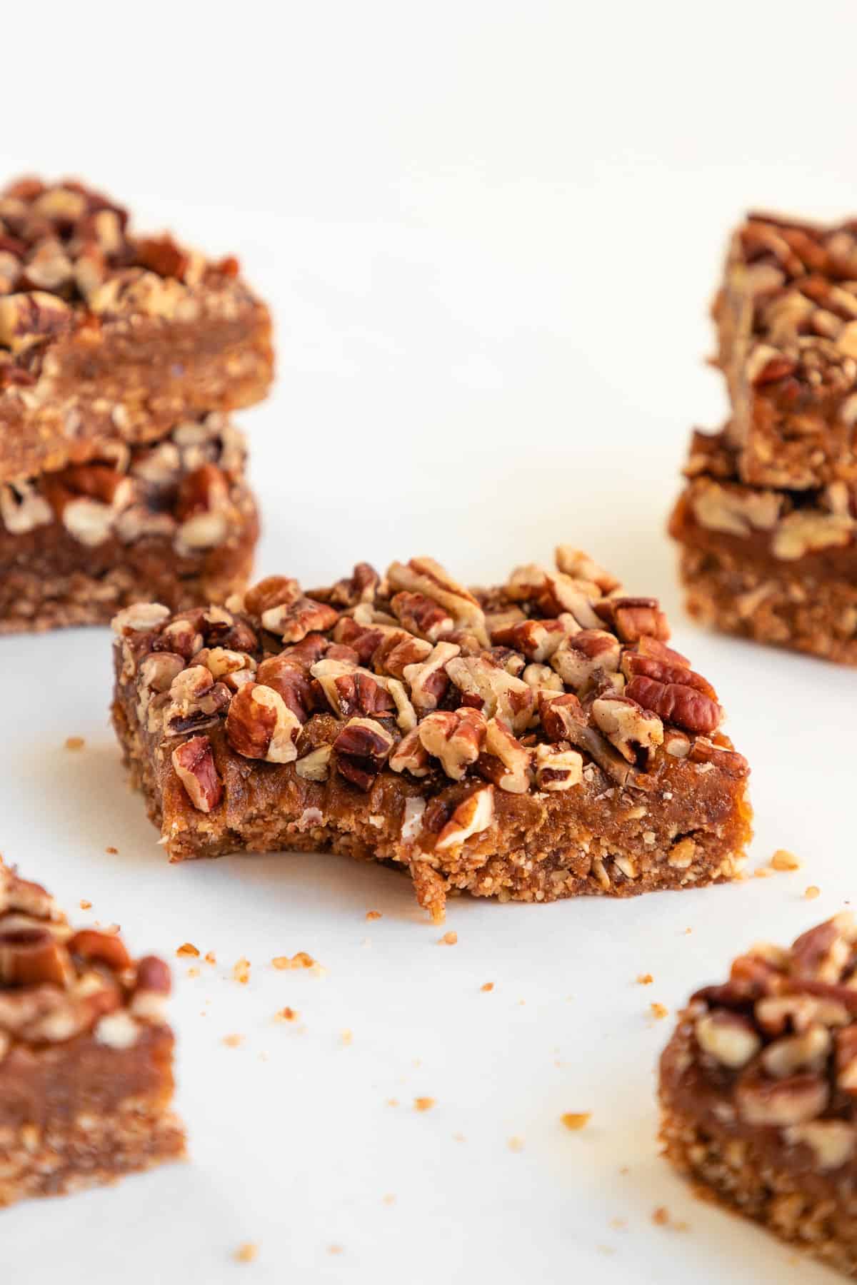 a no-bake pecan pie bar with a bite taken out of it