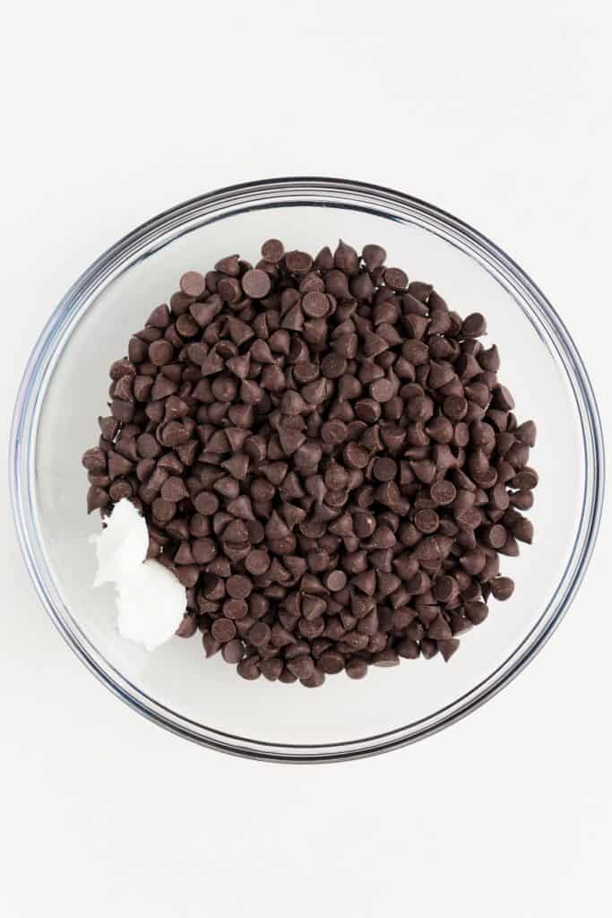 chocolate chips and coconut oil inside a glass bowl