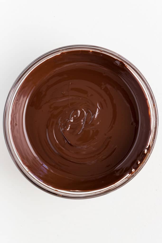 melted chocolate inside a glass bowl