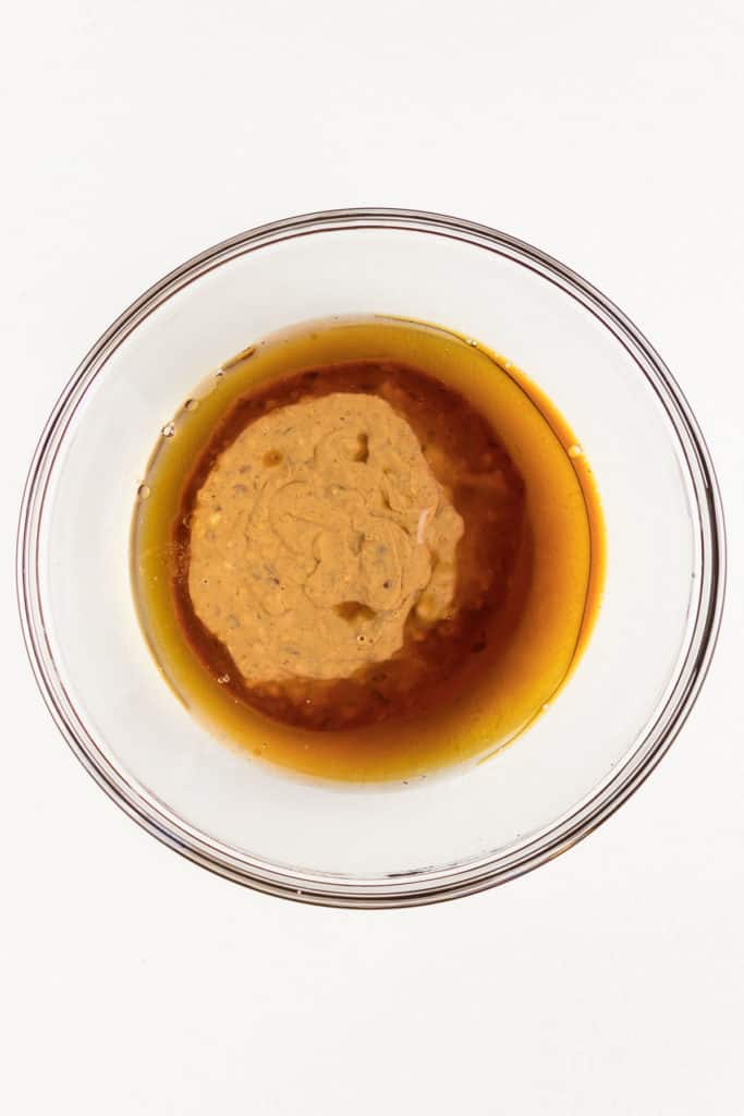 maple syrup and almond butter in a glass bowl