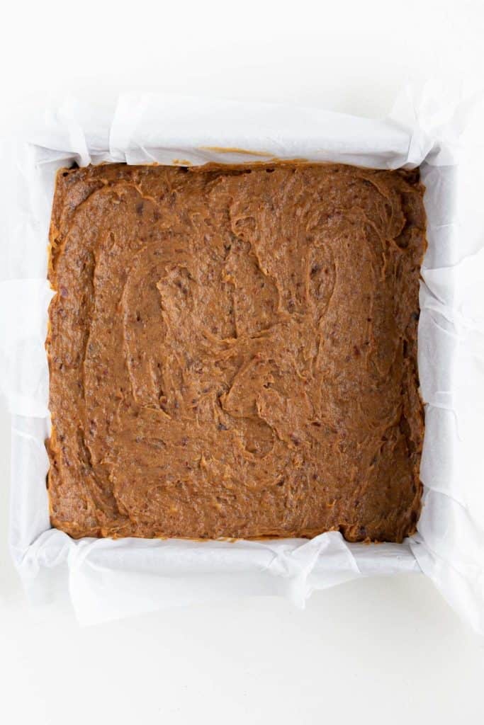 caramel spread across the base of a square baking dish