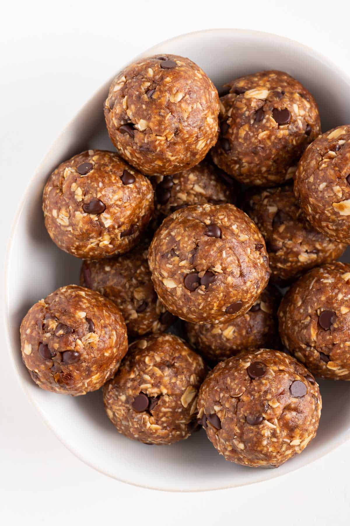 chocolate chip oatmeal cookie dough balls inside a white bowl