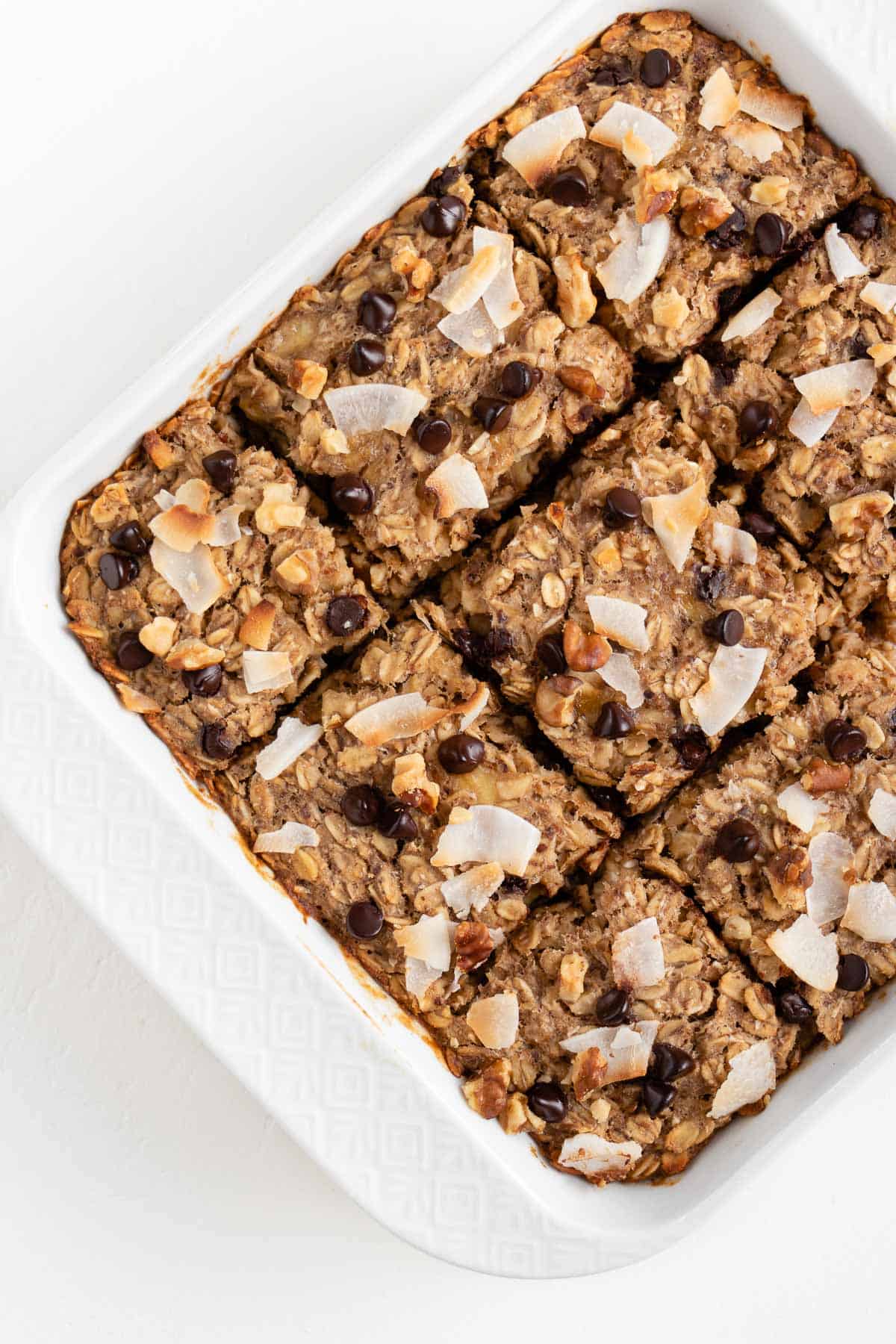 chocolate chip banana baked oatmeal in a square white baking dish