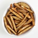 crispy baked french fries in a white bowl