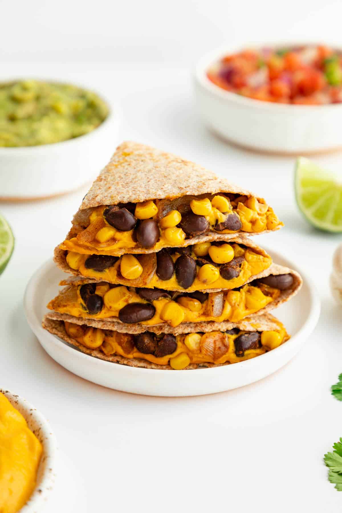 vegan sweet potato black bean quesadillas on a white plate