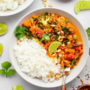 vegan thai curry and basmati rice in a bowl with fresh cilantro on top