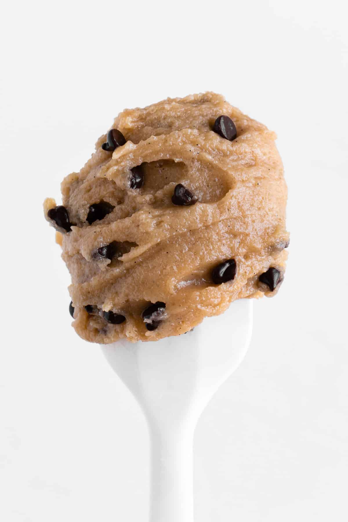 a scoop of chocolate chip cookie dough on a white spatula