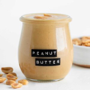 homemade peanut butter in a small glass jar
