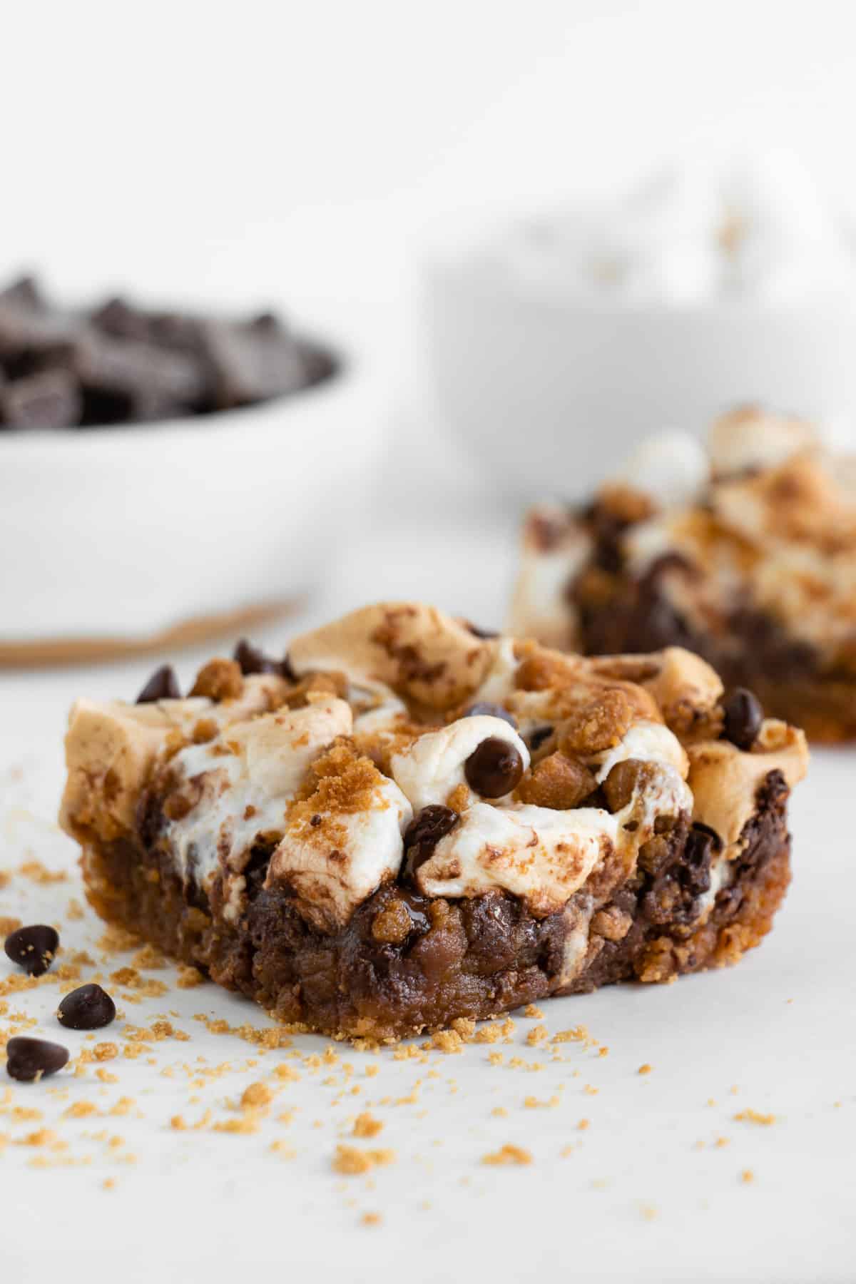 a vegan s'mores bar topped with mini marshmallows and chocolate chips