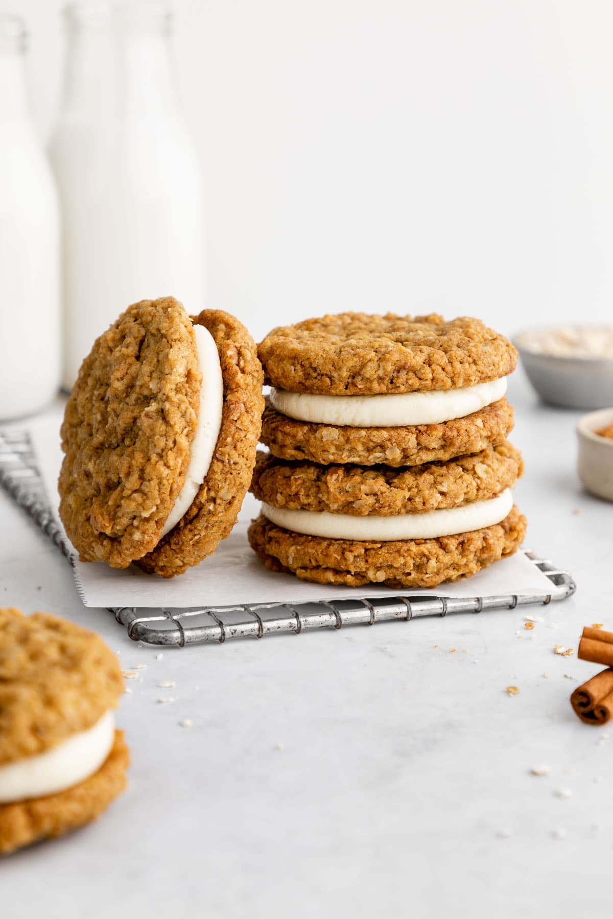 five oatmeal cookies on a wire cooling rack