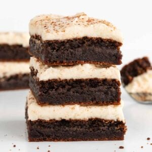 a stack of three vegan frosted gingerbread cookie bars