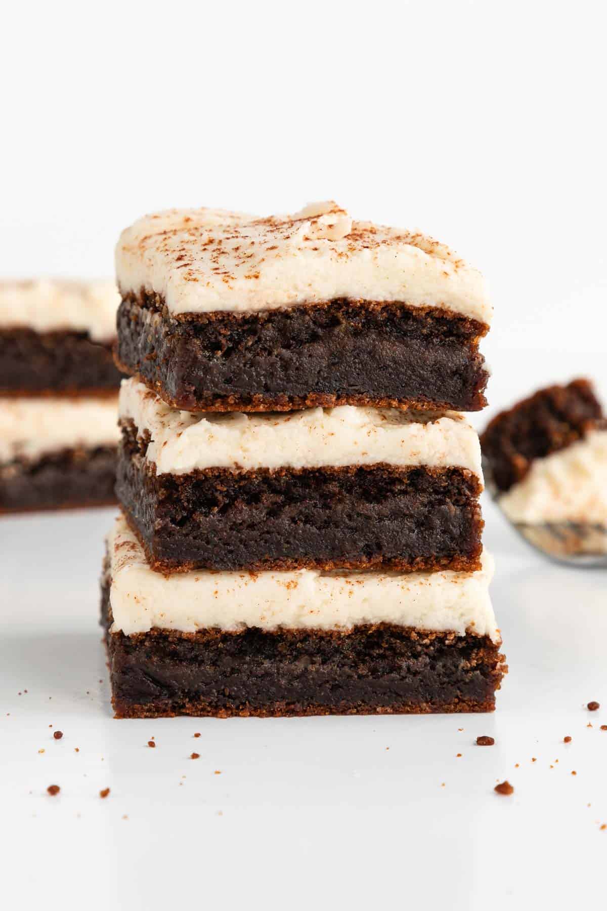 a stack of three vegan frosted gingerbread cookie bars