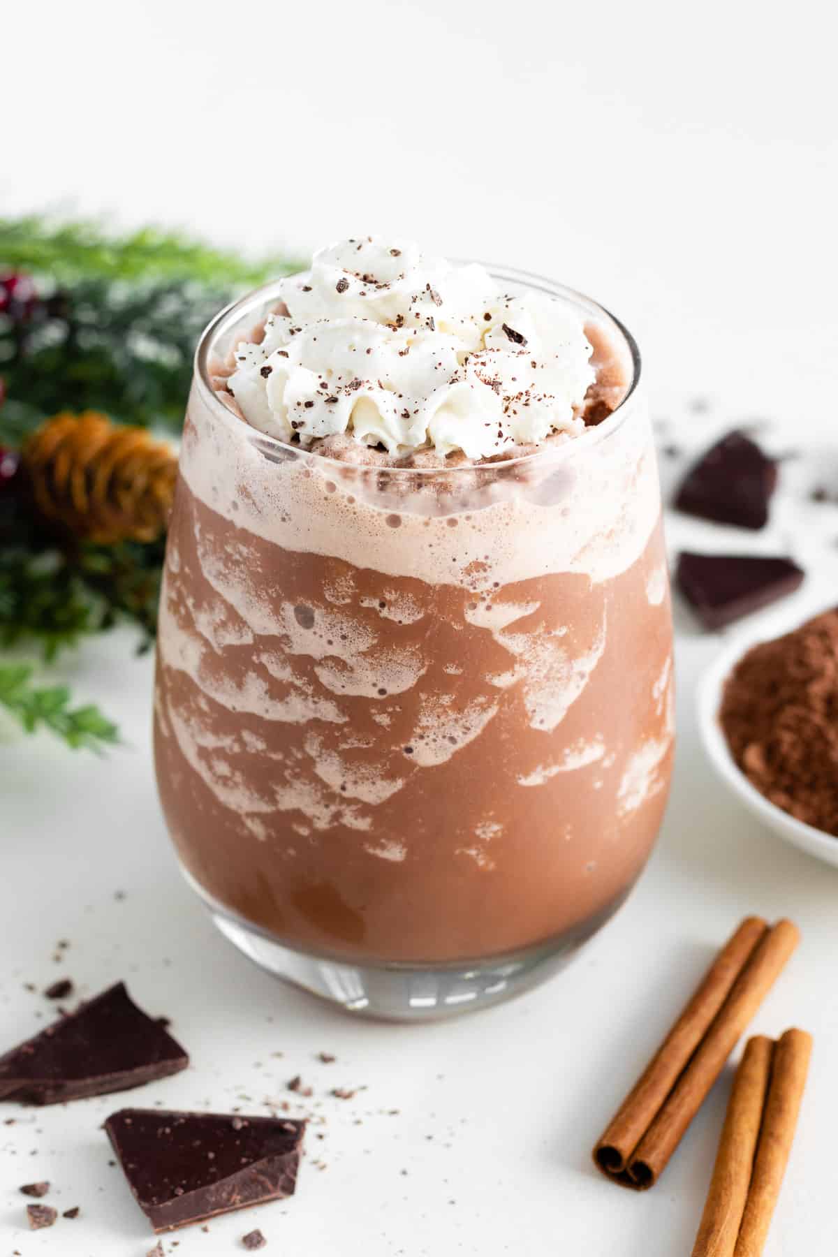 vegan frozen hot chocolate in a glass with whipped cream on top