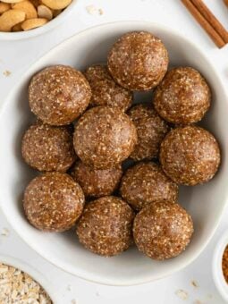 cinnamon roll energy balls inside a white bowl