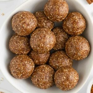 cinnamon roll energy balls inside a white bowl