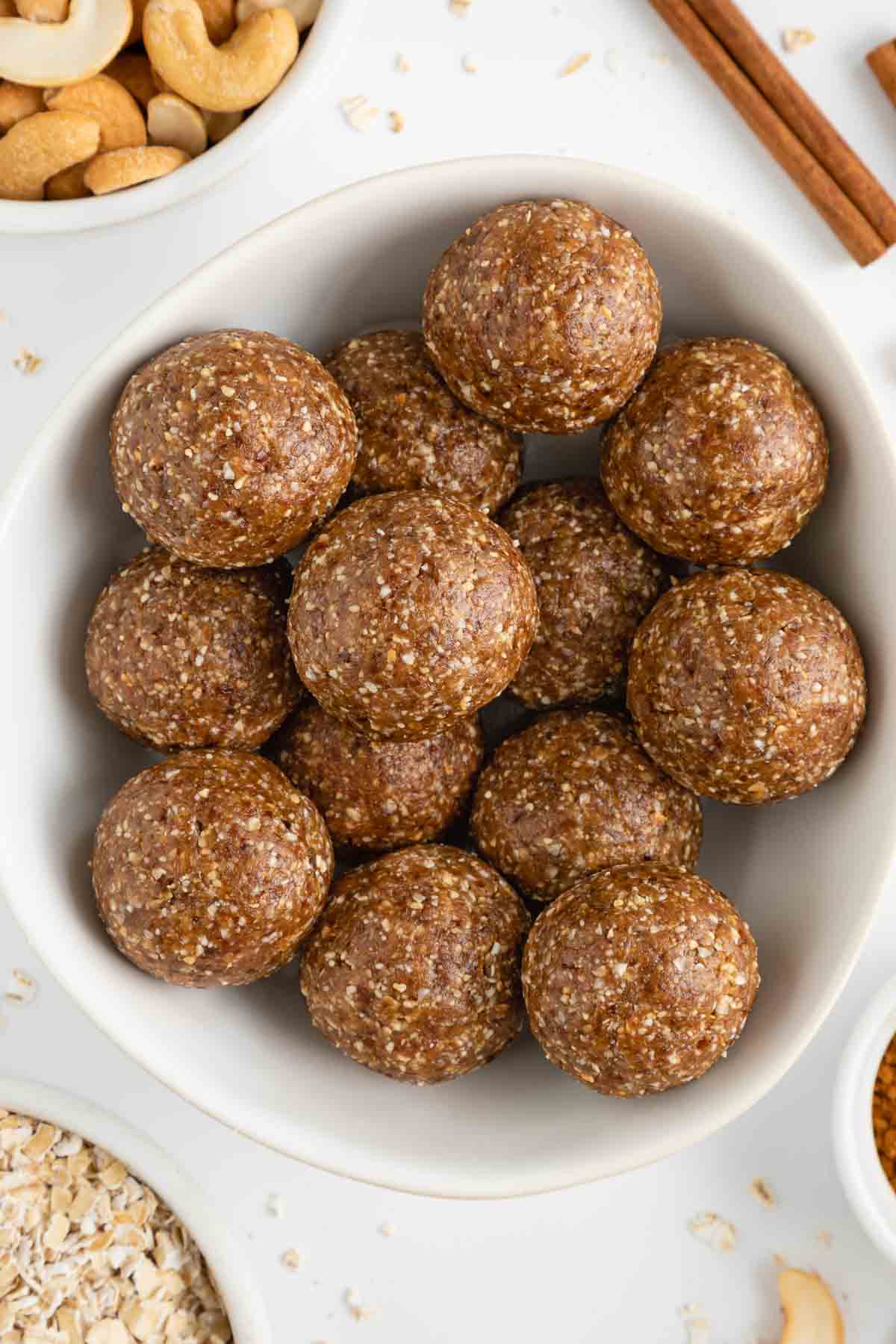 cinnamon roll energy balls inside a white bowl