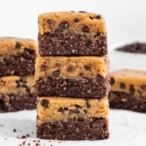 a stack of three no bake cookie dough brownies