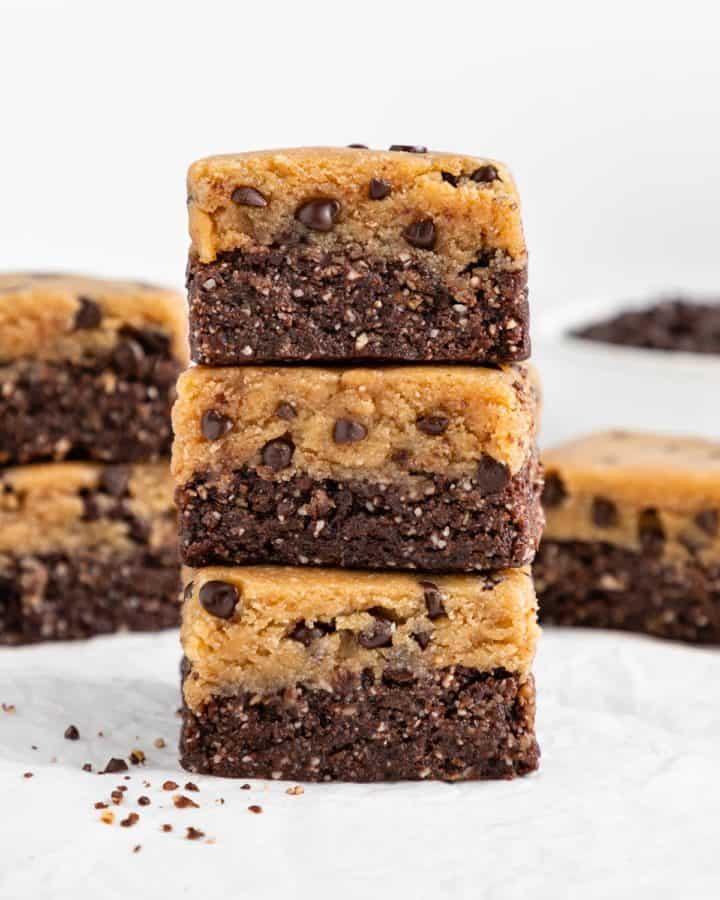 a stack of three no bake cookie dough brownies