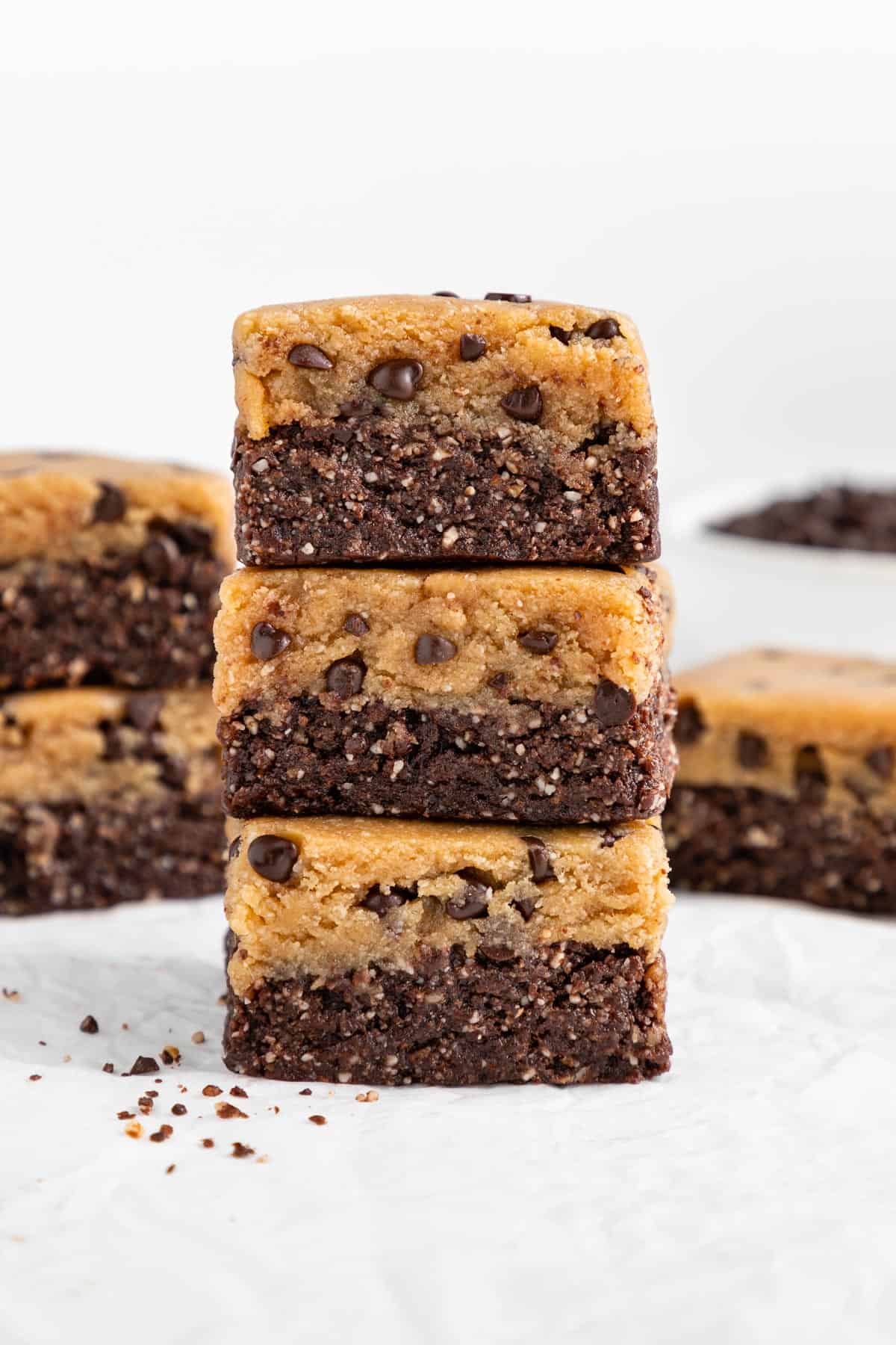 a stack of three no bake cookie dough brownies