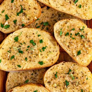 close up image of vegan garlic bread with parmesan