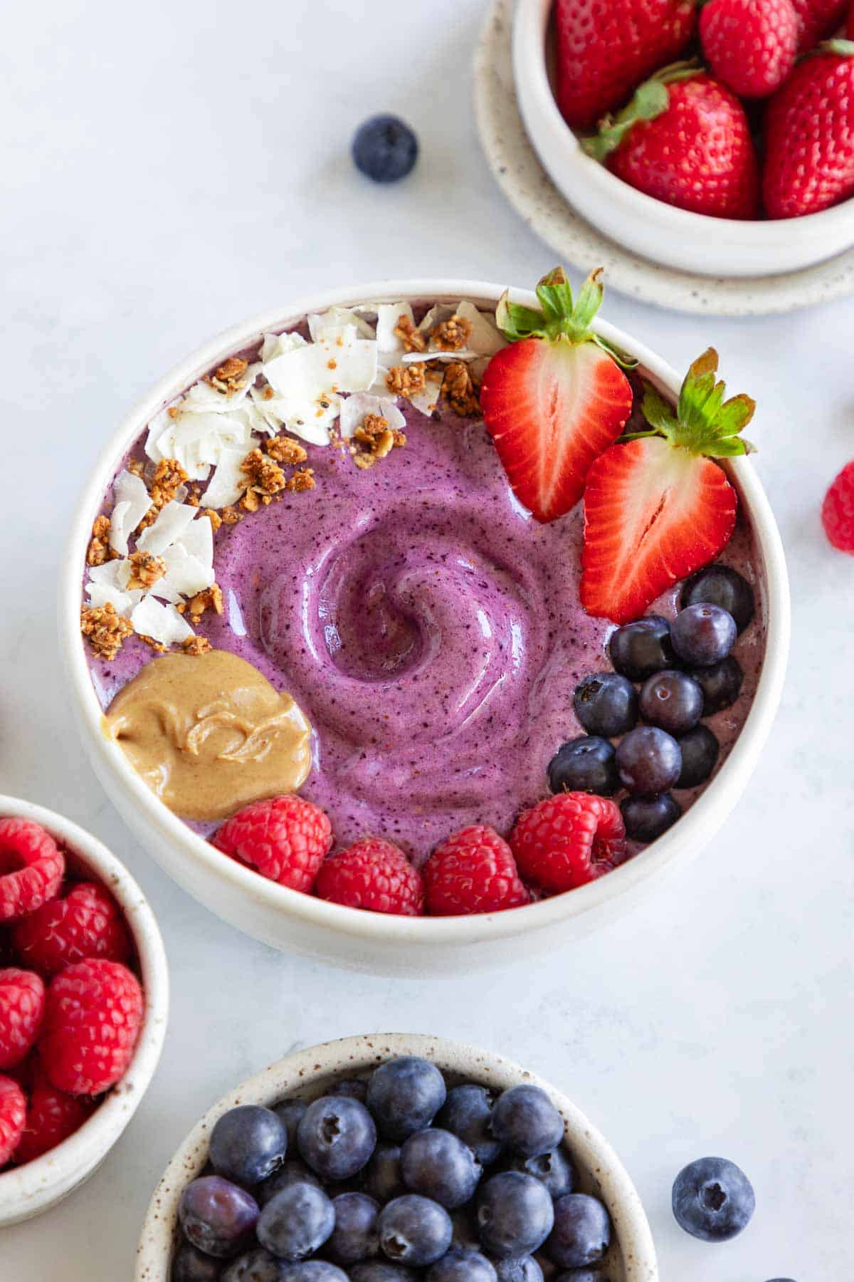 berry smoothie bowl with strawberries, blueberries, and raspberries