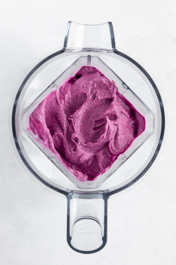 a thick and creamy berry smoothie inside a vitamix blender