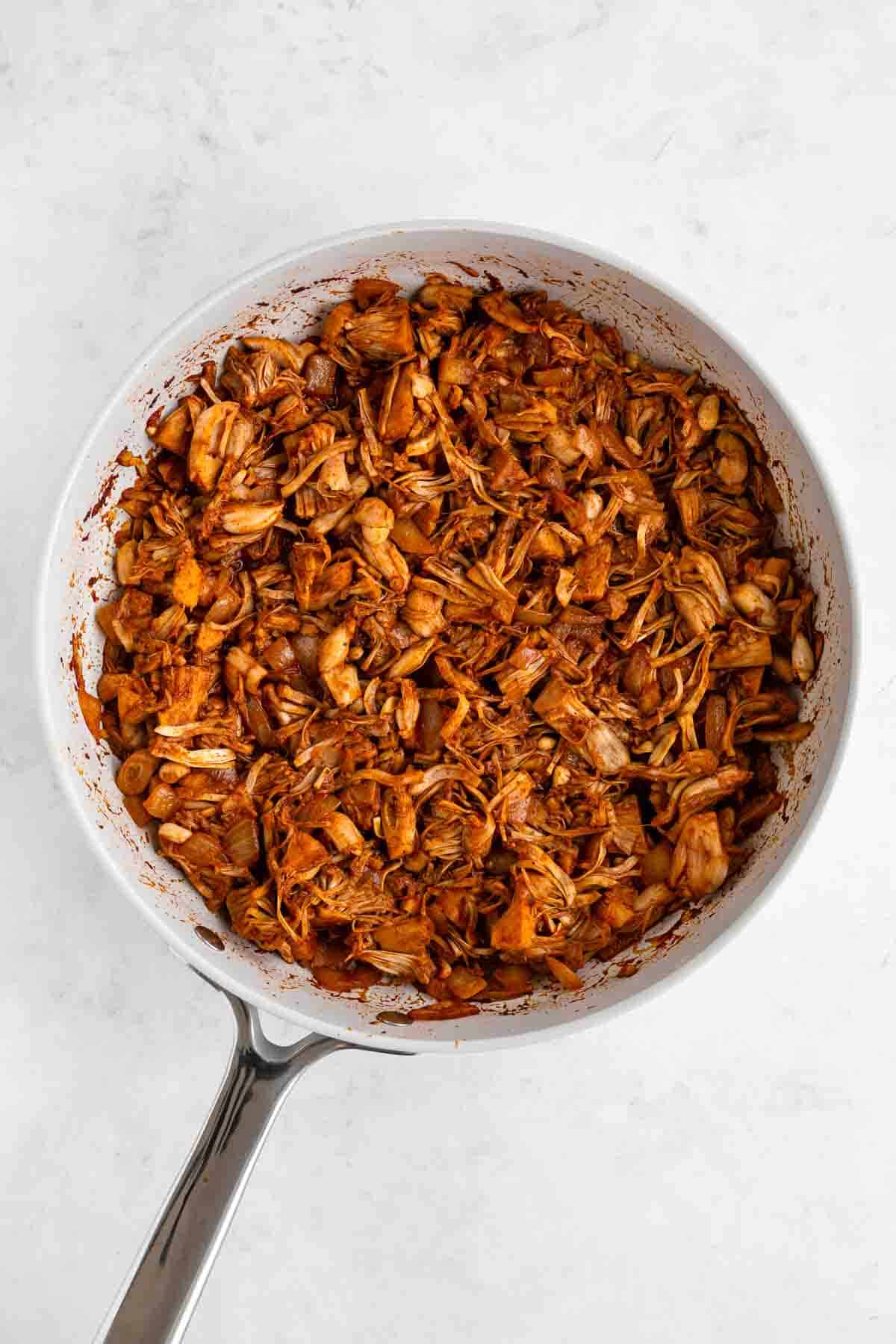 cooking spicy shredded jackfruit on a pan