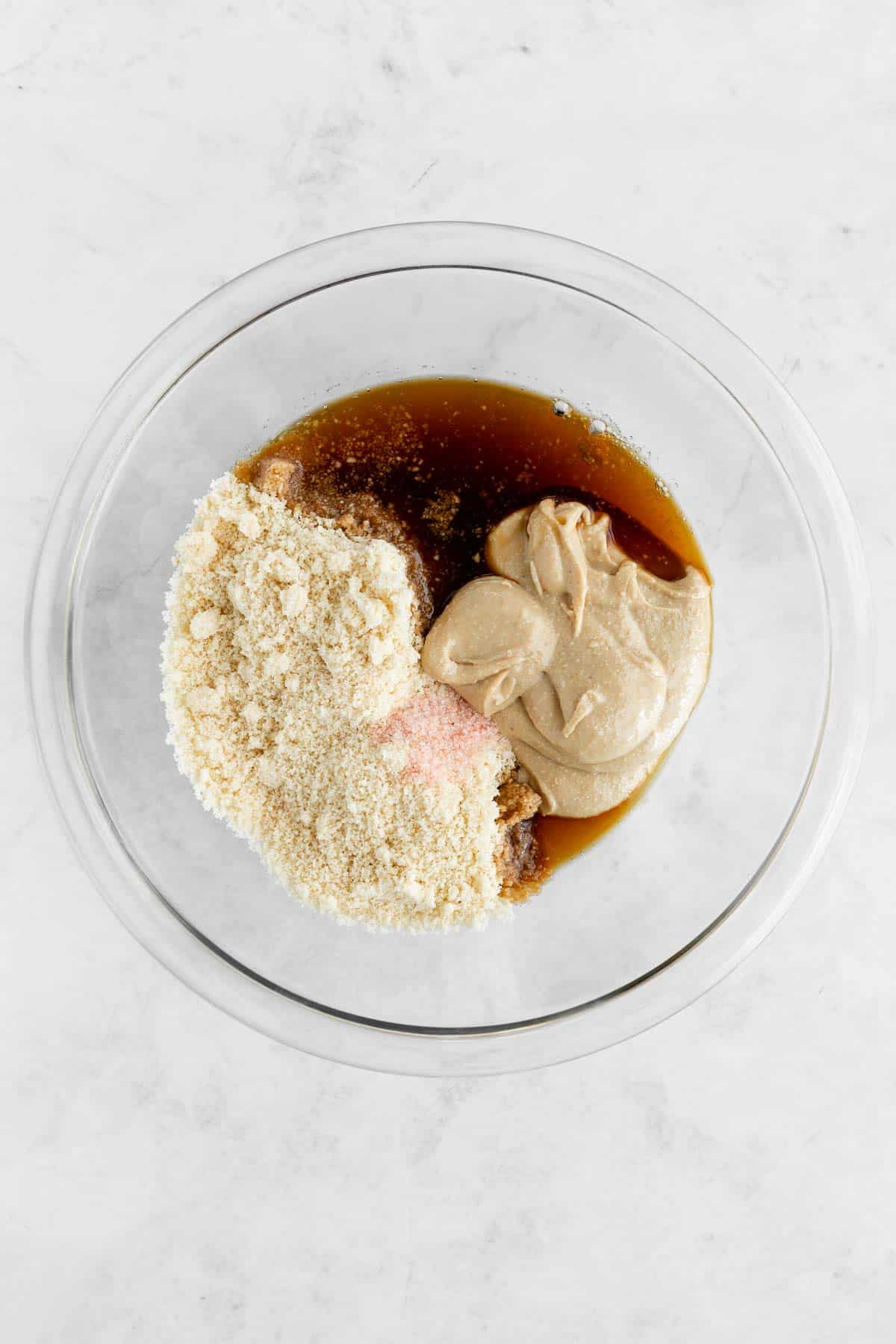 almond flour, cashew butter, maple syrup, and salt in a glass mixing bowl