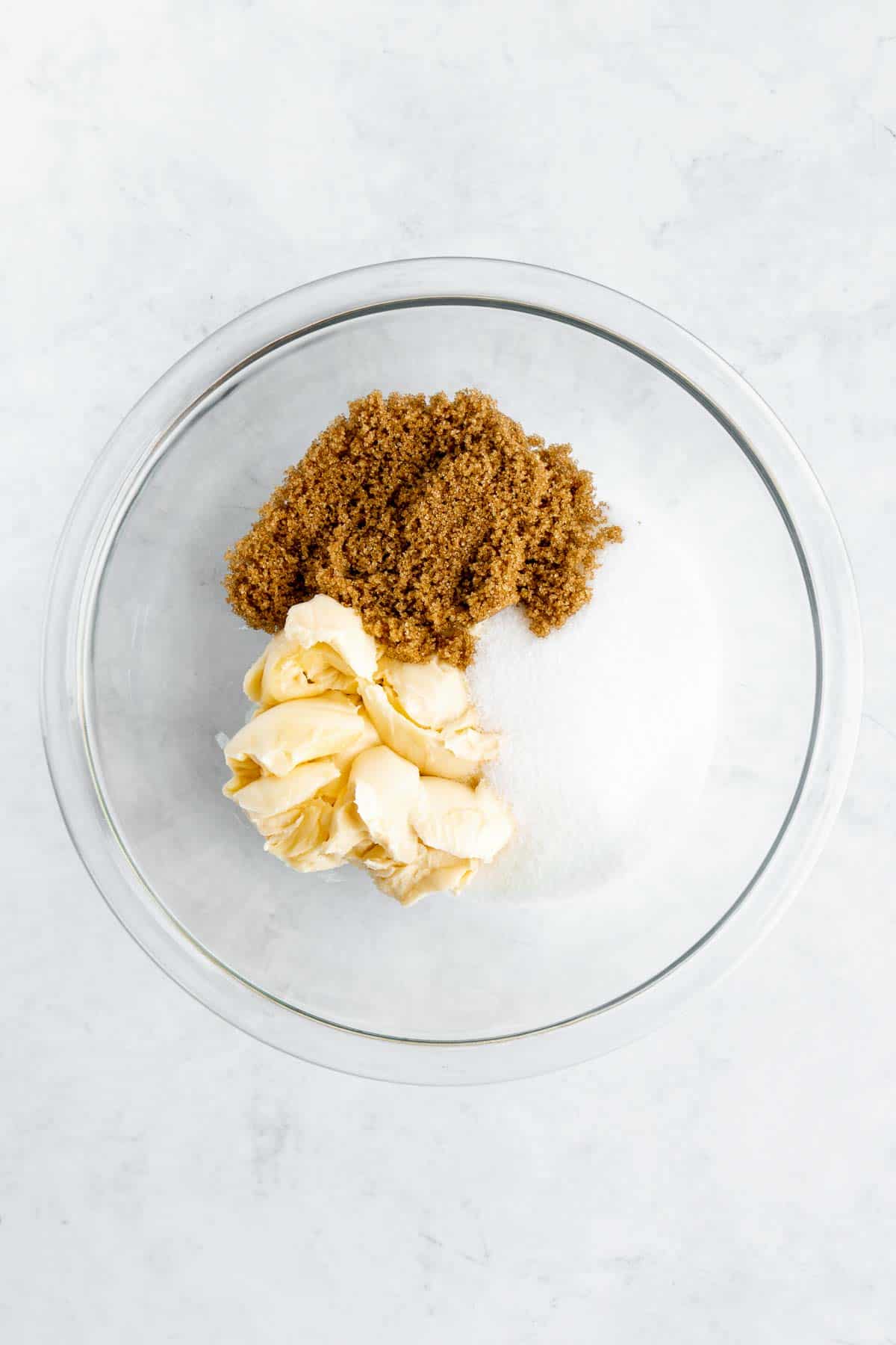 vegan butter, brown sugar, and cane sugar in a glass bowl