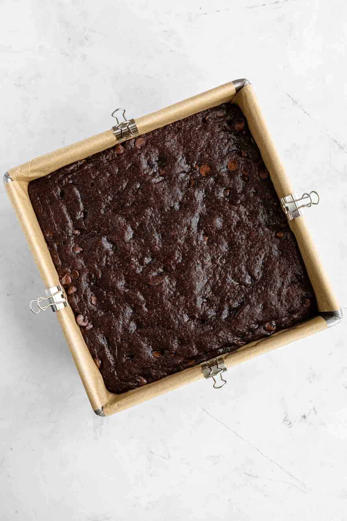 baked vegan brownies in a square baking dish