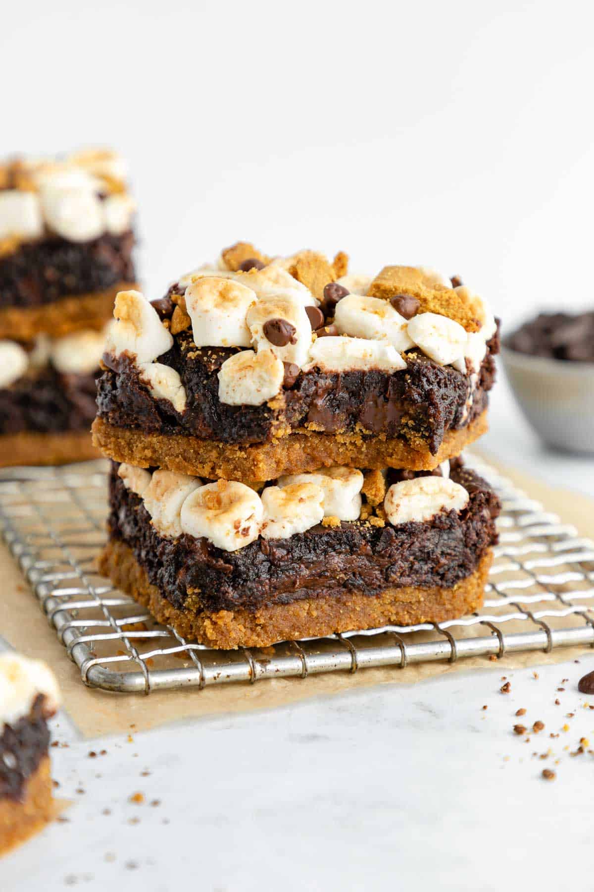 a stack of two vegan s'mores brownies on a wire cooling rack