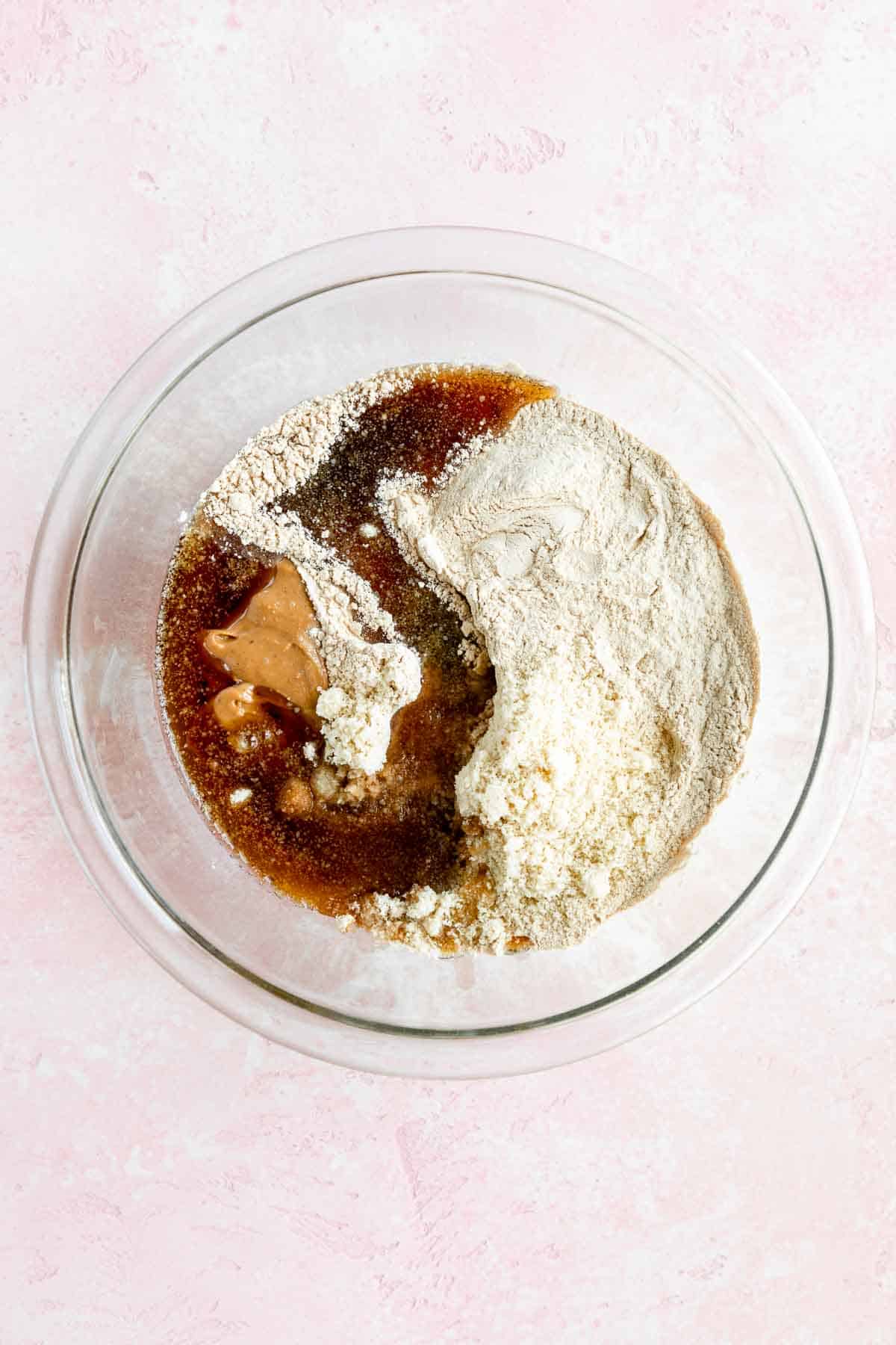 cashew butter, funfetti protein powder, maple syrup, almond flour, and sprinkles in a glass pyrex bowl