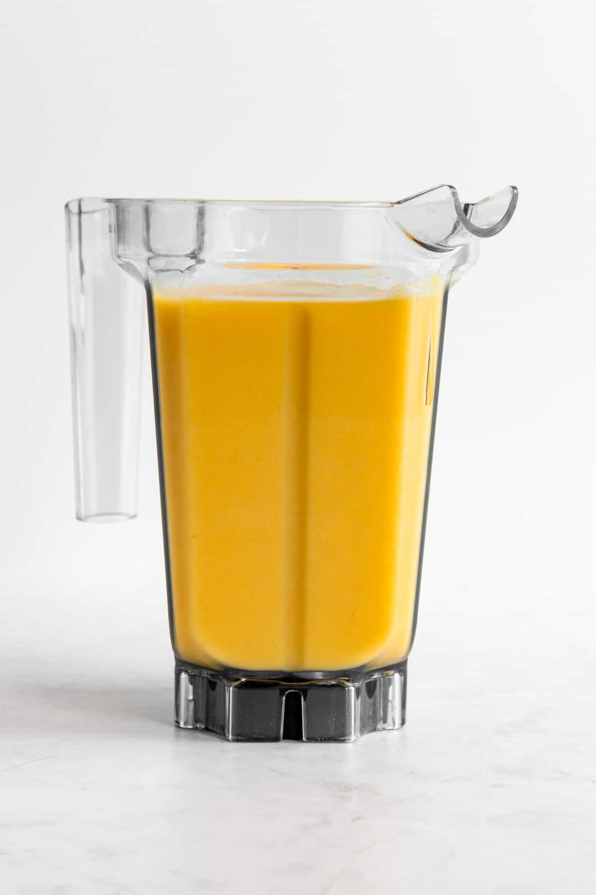 banana mango smoothie blended inside a vitamix blender
