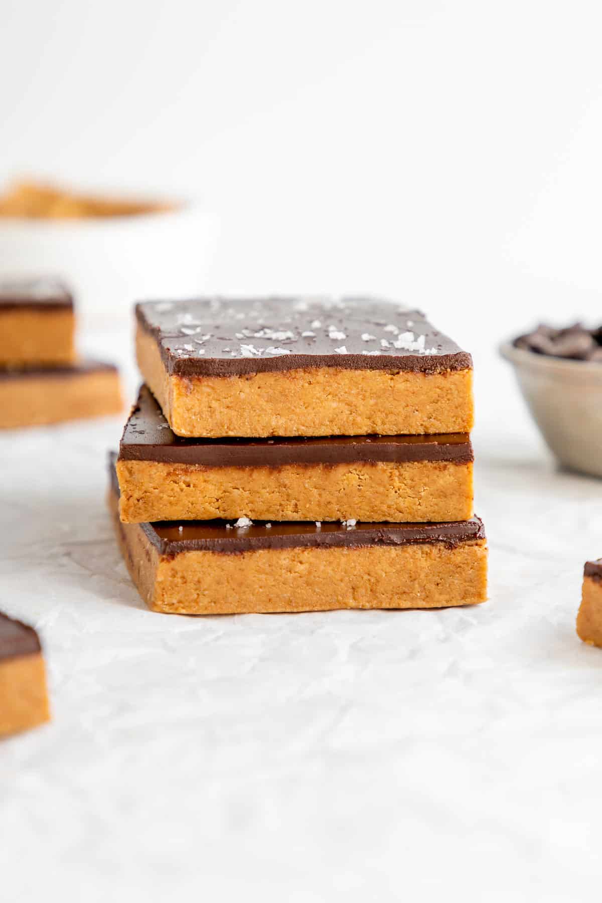 a stack of three homemade chocolate peanut butter protein bars