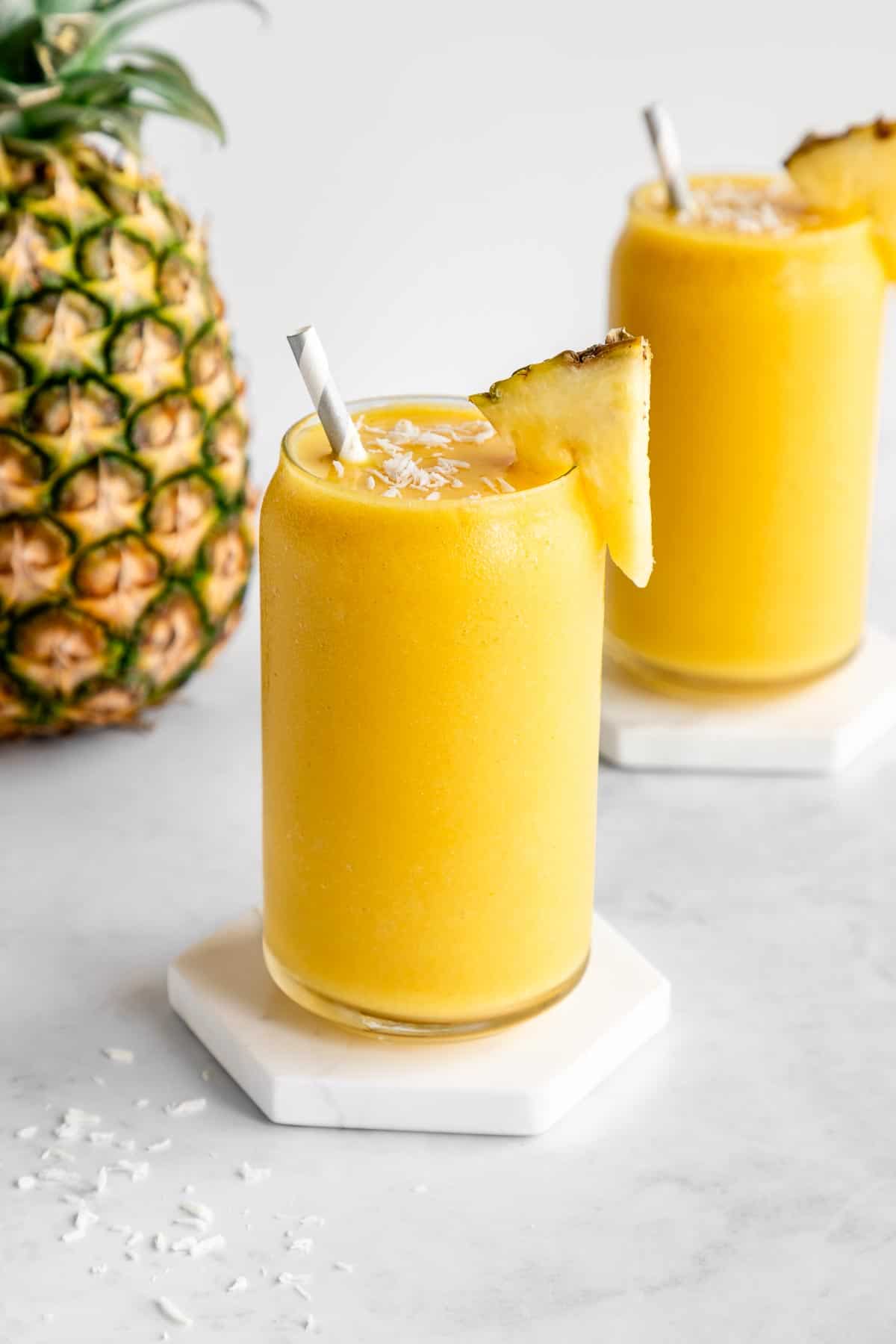 a pineapple coconut smoothie inside a glass