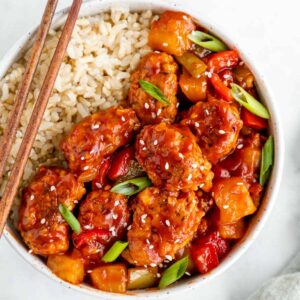 vegan sweet and sour pork with brown rice in a bowl