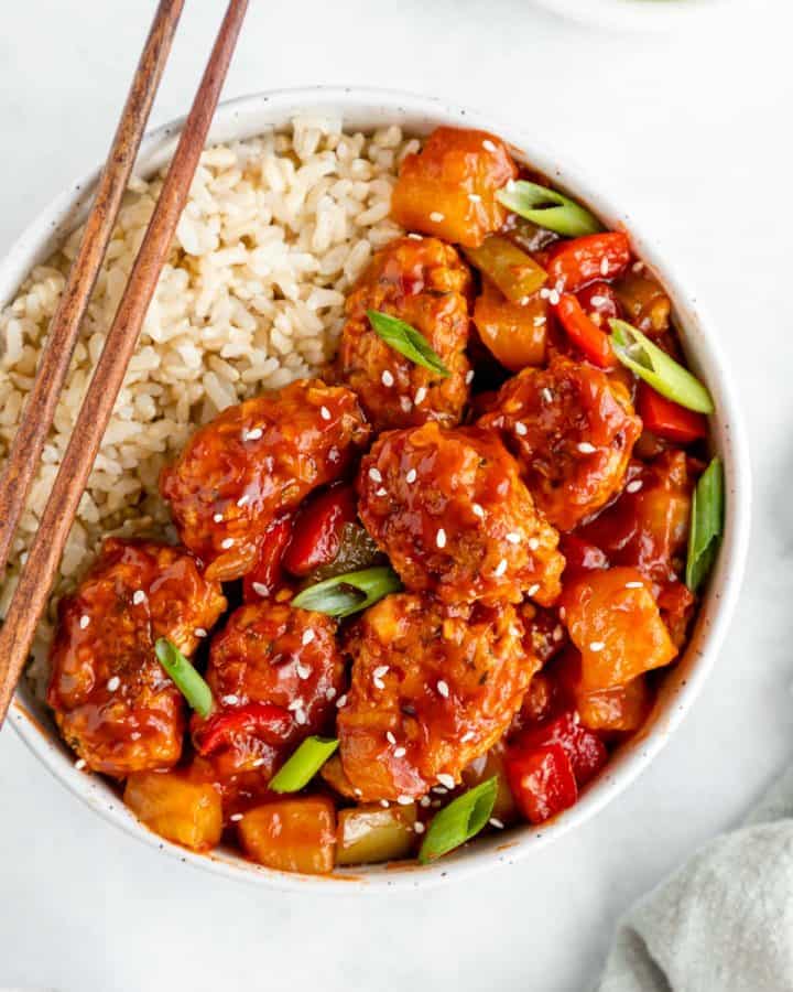vegan sweet and sour pork with brown rice in a bowl