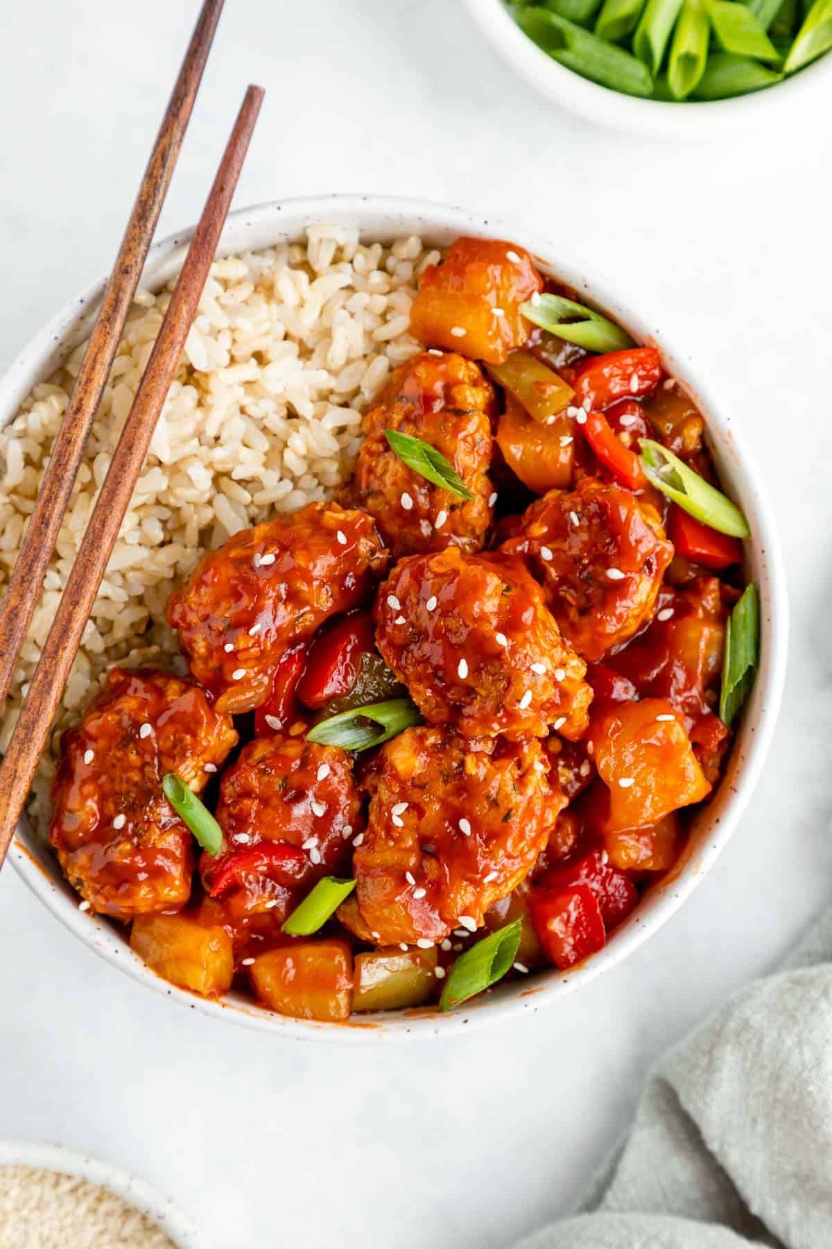 vegan sweet and sour pork with brown rice in a bowl