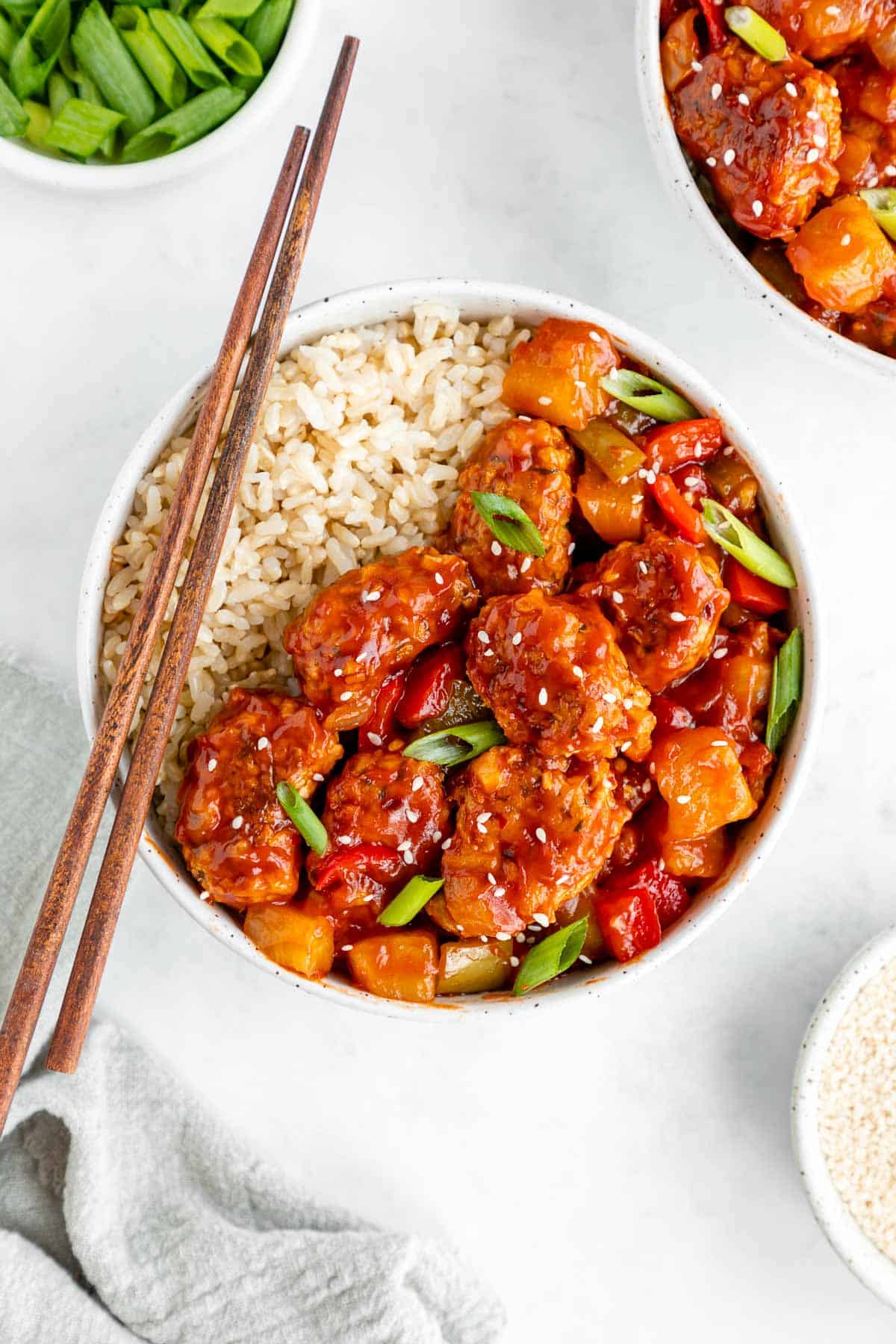 a bowl of vegan sweet and sour pork with brown rice