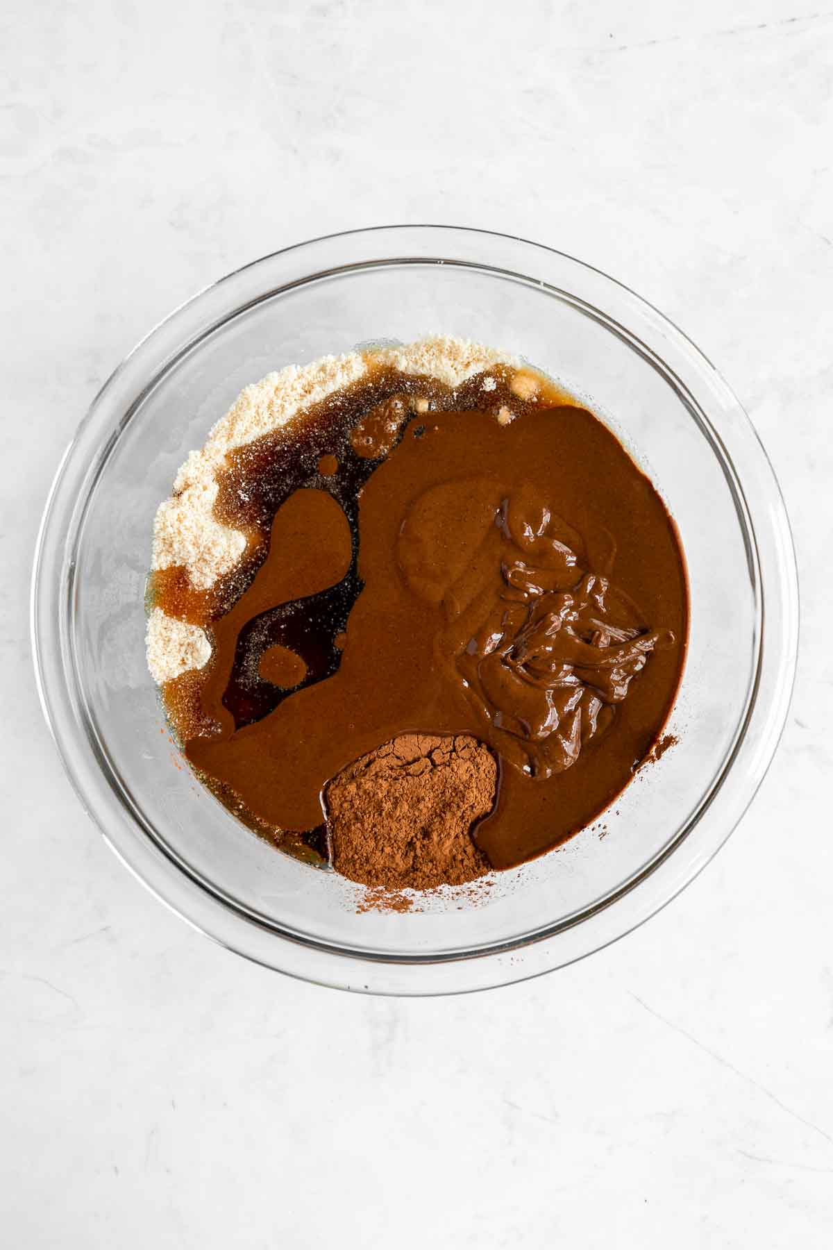 almond flour, hazelnut butter, maple syrup, cacao powder, and salt in a glass mixing bowl