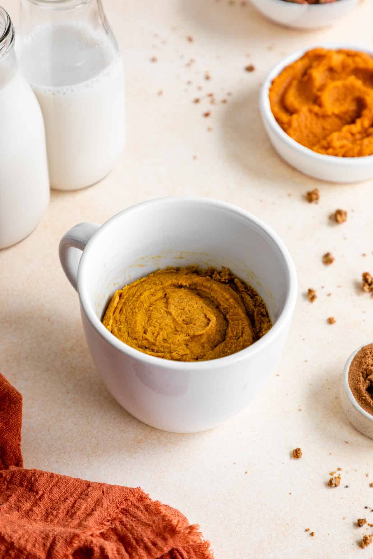 vegan gluten-free pumpkin mug cake inside a white mug