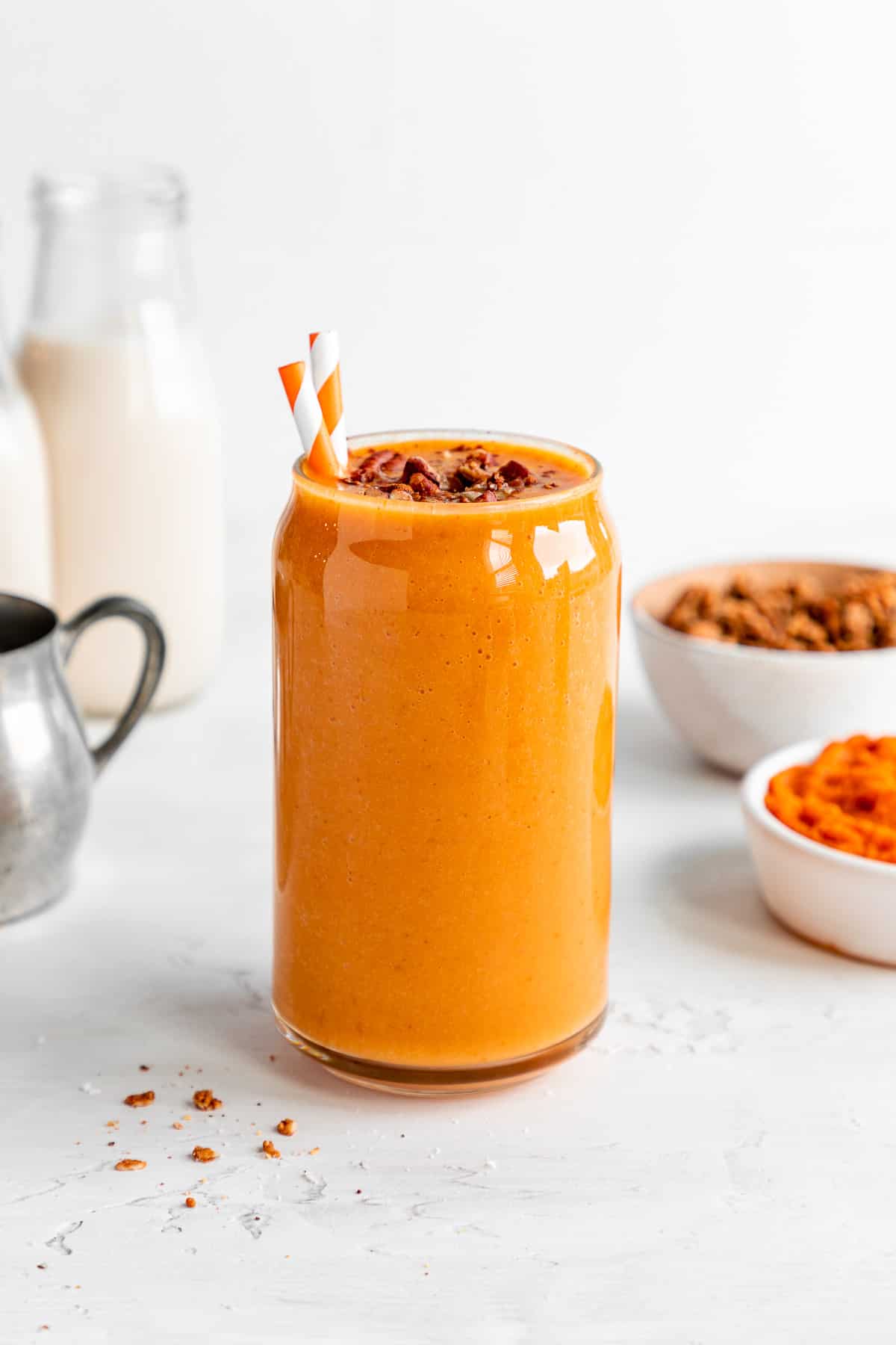 pumpkin pie smoothie in a glass with granola