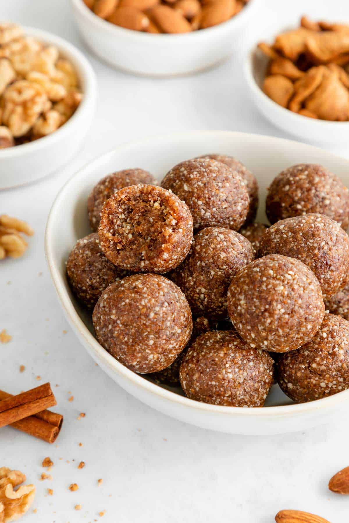 a bowl filled with a stack of apple pie energy bites