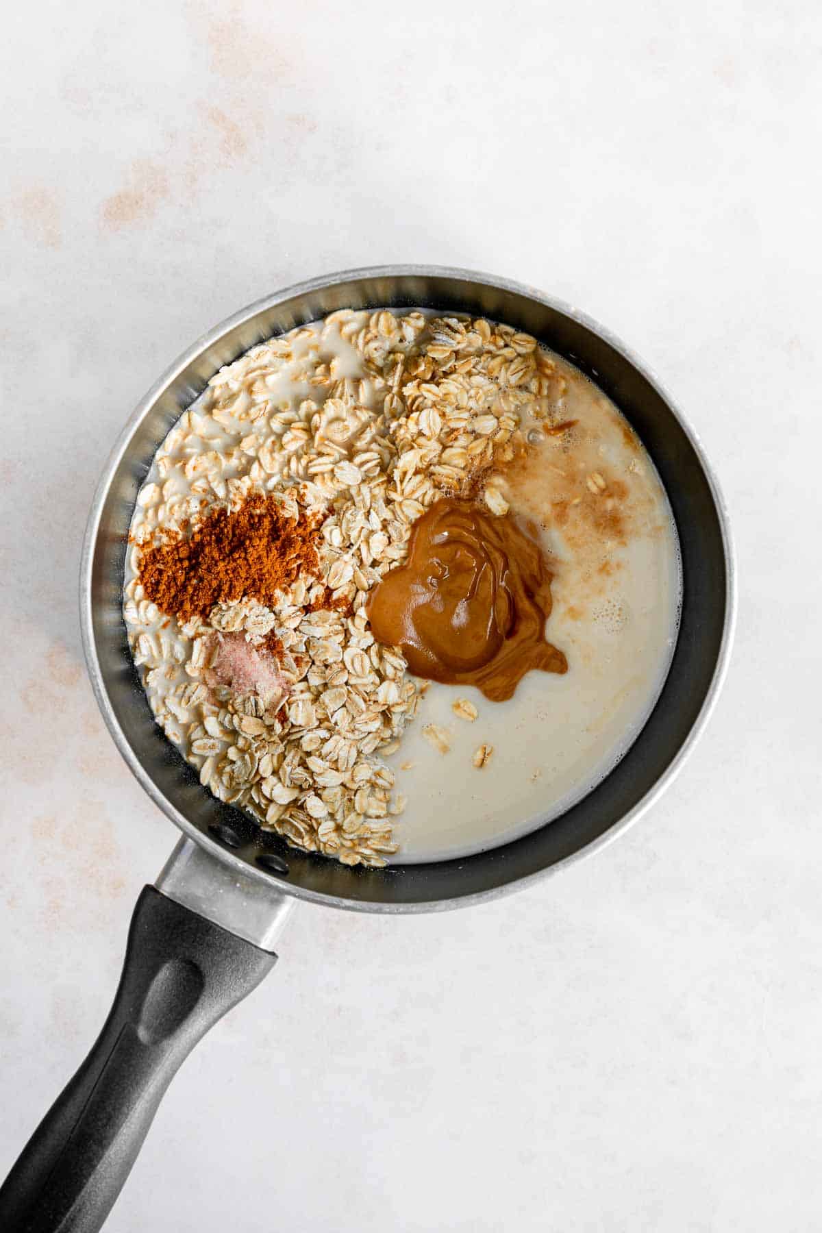 rolled oats, vegan caramel sauce, cinnamon, almond milk, salt, and vanilla in a pot