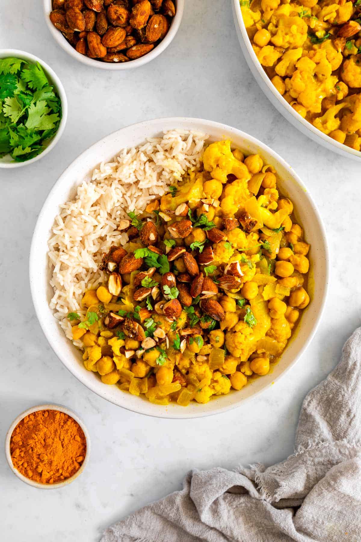 a bowl of chickpea cauliflower turmeric curry with white rice