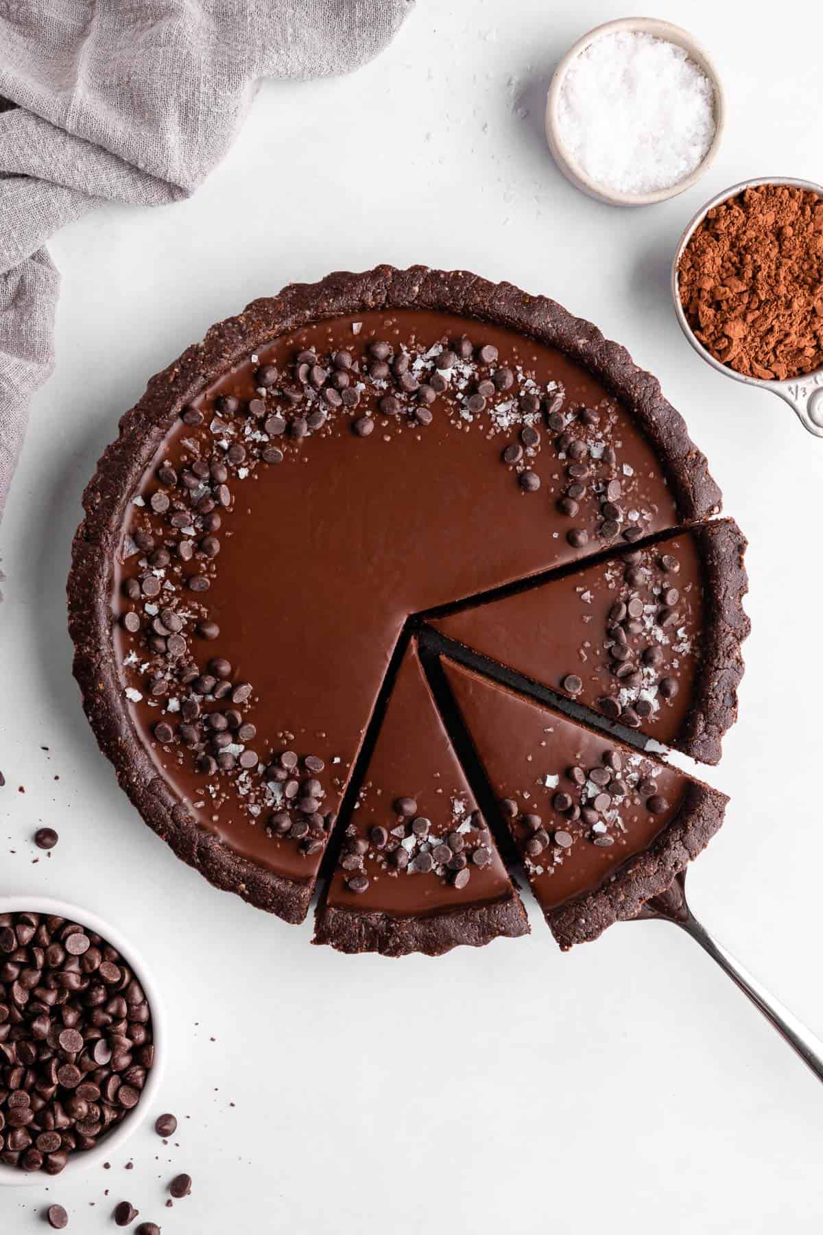 slicing a no-bake vegan chocolate tart