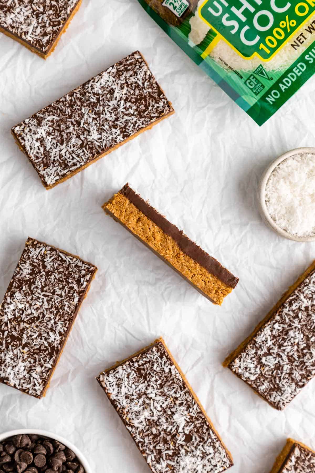 no-bake coconut protein bars on white parchment paper