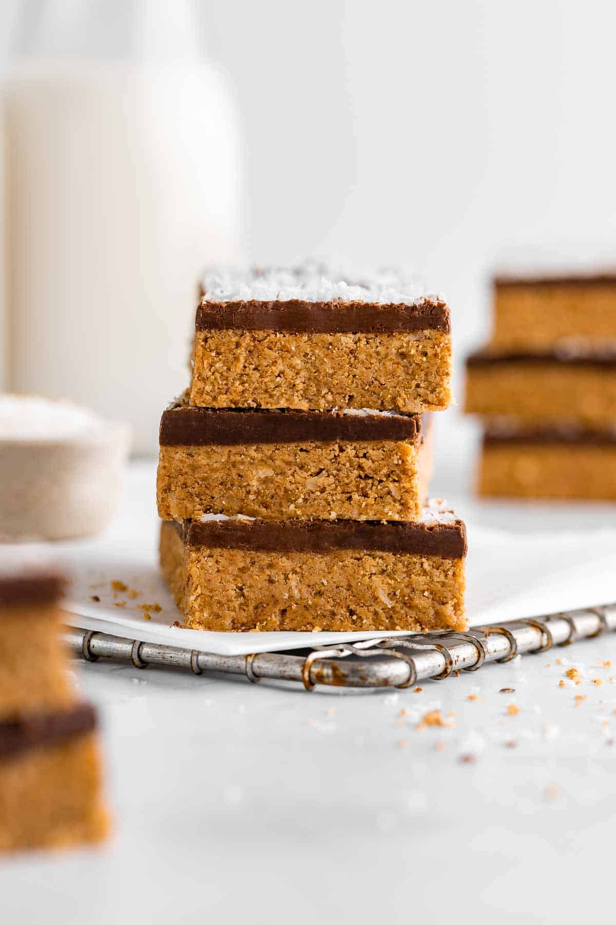 a stack of three no-bake coconut protein bars