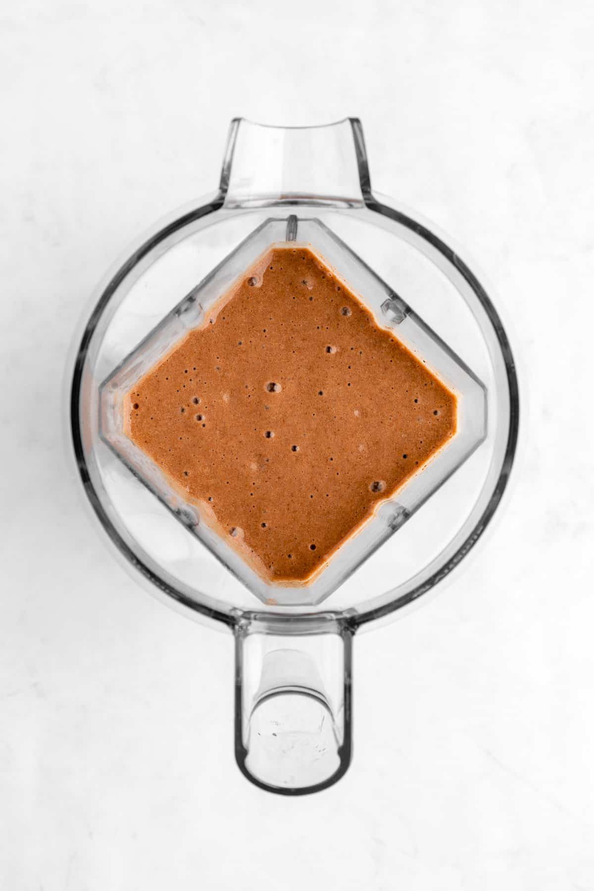 a blended chocolate banana smoothie inside a vitamix blender